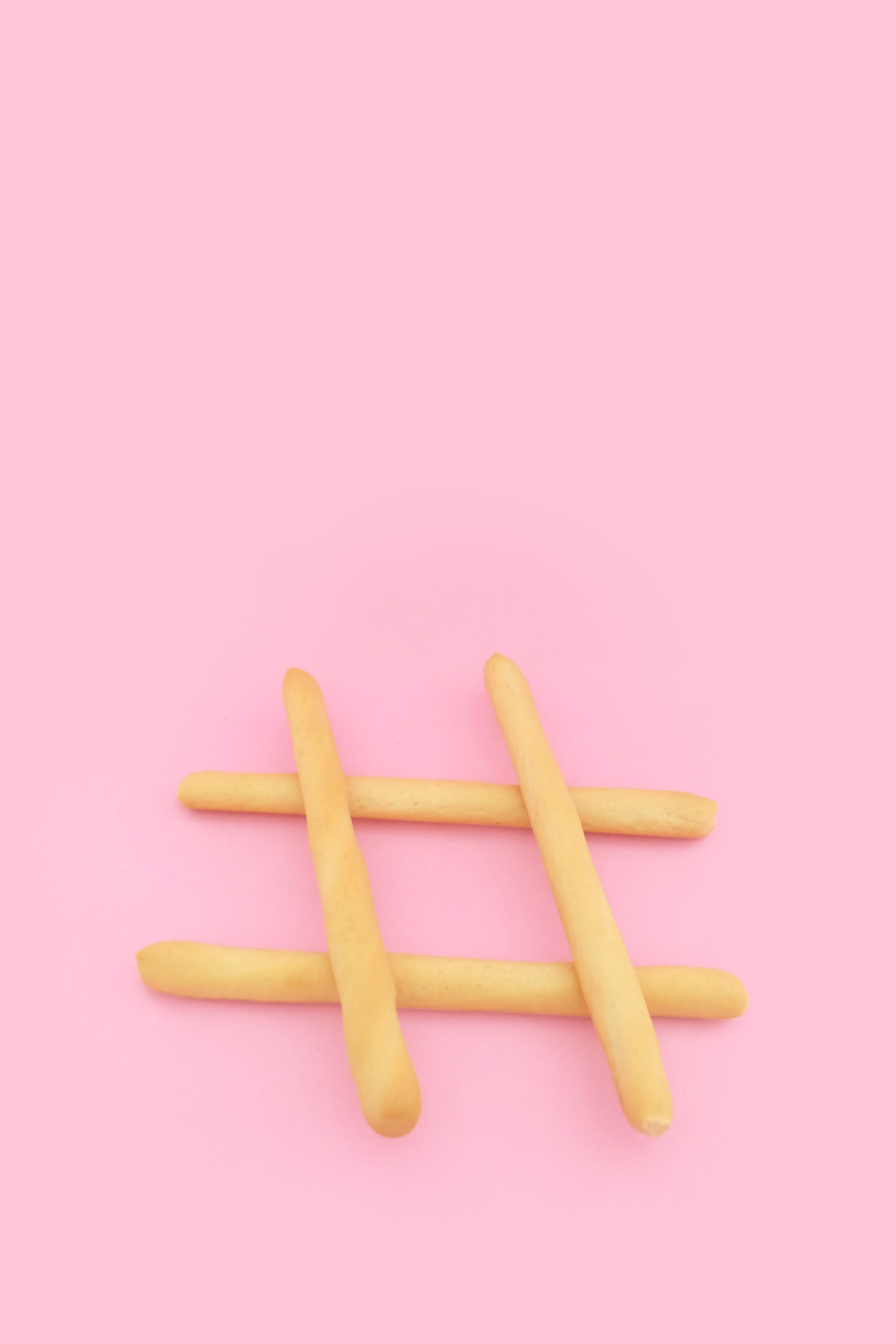 french-fries-used-as-hashtag-symbol-on-pink-background
